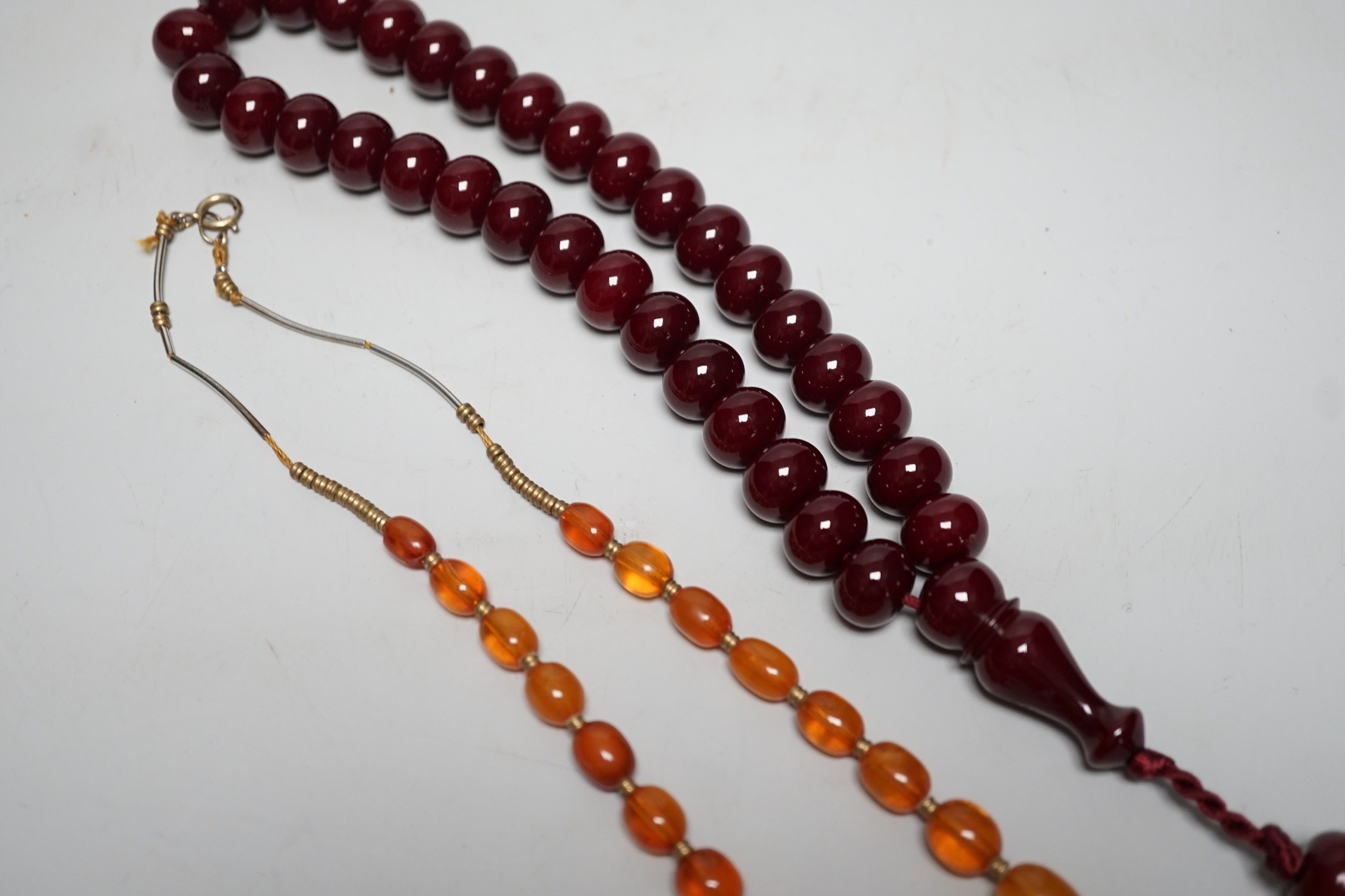 A Chinese amber and cherry amber type necklace